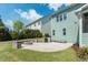 Spacious backyard patio perfect for entertaining, complete with a fire pit and outdoor grill at 7101 Gibson Creek Pl, Cary, NC 27519