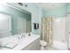 The bathroom features a tub shower, a framed mirror, and a single sink vanity at 7101 Gibson Creek Pl, Cary, NC 27519