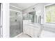Bathroom featuring a spacious glass shower, and a vanity with modern fixtures at 7101 Gibson Creek Pl, Cary, NC 27519