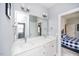The bathroom features a dual sink vanity with a framed mirror and views into the bedroom at 7101 Gibson Creek Pl, Cary, NC 27519