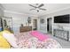 Bedroom with plush carpeting, modern decor, and a ceiling fan at 7101 Gibson Creek Pl, Cary, NC 27519
