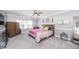 Bright bedroom featuring carpet, neutral walls, ceiling fan, and stylish furnishings at 7101 Gibson Creek Pl, Cary, NC 27519