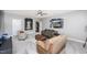 Spacious bonus room featuring comfortable seating, a ceiling fan, and sports themed decor at 7101 Gibson Creek Pl, Cary, NC 27519