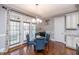 Dining area with modern table and chairs, natural light, and hardwood floors at 7101 Gibson Creek Pl, Cary, NC 27519