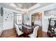 Tastefully decorated dining room featuring modern decor, beautiful lighting, and a large window at 7101 Gibson Creek Pl, Cary, NC 27519