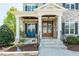 Close-up of the front porch showcasing stone columns and a cozy seating area at 7101 Gibson Creek Pl, Cary, NC 27519