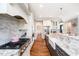 Kitchen with granite countertops, stainless steel appliances, and white cabinets at 7101 Gibson Creek Pl, Cary, NC 27519
