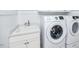 Well-equipped laundry room with a Samsung washer and dryer and a utility sink at 7101 Gibson Creek Pl, Cary, NC 27519