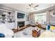 Cozy living room with built-in shelving, a fireplace, and comfortable seating at 7101 Gibson Creek Pl, Cary, NC 27519