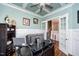 Office with coffered ceiling, fan, and hardwood flooring at 7101 Gibson Creek Pl, Cary, NC 27519