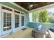 Inviting screened porch featuring a ceiling fan, comfortable seating, and a view of the outdoors at 7101 Gibson Creek Pl, Cary, NC 27519