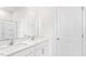 Bathroom featuring double vanity sinks and a separate toilet room at 764 Dorset Stream Dr, Fuquay Varina, NC 27526