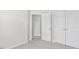 Bedroom featuring light carpet, access to a closet, and access to the hall at 764 Dorset Stream Dr, Fuquay Varina, NC 27526