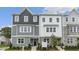 New townhome with gray and white siding, large windows, and fresh landscaping at 764 Dorset Stream Dr, Fuquay Varina, NC 27526