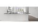 Modern kitchen features a breakfast bar with gray countertops and stainless appliances at 764 Dorset Stream Dr, Fuquay Varina, NC 27526