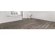 Inviting living room featuring wood-look flooring and a breakfast bar at 764 Dorset Stream Dr, Fuquay Varina, NC 27526