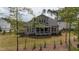 Scenic backyard featuring a screened-in porch and lush green space at 8208 Bella Oak Ct, Wake Forest, NC 27587