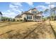Well-maintained backyard featuring a large lawn and a screened in porch at 8208 Bella Oak Ct, Wake Forest, NC 27587