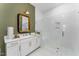 Bright bathroom featuring white cabinetry, quartz counters, and a glass-enclosed shower at 8208 Bella Oak Ct, Wake Forest, NC 27587