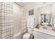 Well-lit bathroom with shower-tub combo, modern fixtures, and neutral decor at 8208 Bella Oak Ct, Wake Forest, NC 27587