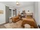 Tastefully decorated bedroom featuring two twin beds, plush rug, and natural light from the window at 8208 Bella Oak Ct, Wake Forest, NC 27587