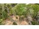 Aerial view of golf course, surrounded by lush green trees at 8208 Bella Oak Ct, Wake Forest, NC 27587