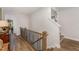 Bright hallway with wooden floors, staircase, and natural light at 8208 Bella Oak Ct, Wake Forest, NC 27587