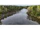 Scenic aerial view of the lake surrounded by lush green trees at 8208 Bella Oak Ct, Wake Forest, NC 27587