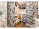 Organized walk-in pantry with wallpaper, built-in shelving, and ample storage space at 8208 Bella Oak Ct, Wake Forest, NC 27587