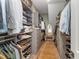 A walk-in closet offering ample storage with shelves and drawers for organizing clothes and shoes at 8208 Bella Oak Ct, Wake Forest, NC 27587