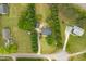 Aerial view of a neighborhood with houses, trees, and green lawns at 905 Tyler Ct, Garner, NC 27529