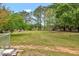 Large backyard with green grass, trees and room to roam at 905 Tyler Ct, Garner, NC 27529