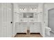Bright bathroom with dual vanities, updated fixtures and shower at 905 Tyler Ct, Garner, NC 27529