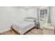 Well-lit bedroom with a bed, hardwood floors, and natural light at 905 Tyler Ct, Garner, NC 27529