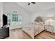 Bright bedroom features wood floors, large window and vaulted ceilings at 905 Tyler Ct, Garner, NC 27529