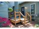 Outdoor deck perfect for entertaining or relaxing, surrounded by lush greenery and a tranquil setting at 918 Albany Ct, Raleigh, NC 27615
