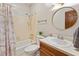 Cozy bathroom featuring a shower and tub combo with updated vanity at 918 Albany Ct, Raleigh, NC 27615