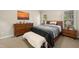 Comfortable bedroom with a queen-size bed, wooden furnishings, and serene decor at 918 Albany Ct, Raleigh, NC 27615