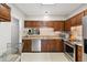 Traditional kitchen features granite countertops, stainless steel appliances, and wooden cabinetry at 918 Albany Ct, Raleigh, NC 27615