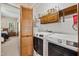 Laundry room with updated appliances and storage space at 918 Albany Ct, Raleigh, NC 27615