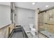 Modern bathroom with dual sinks, sleek fixtures, and a glass enclosed shower at 924 Lynn Rd, Durham, NC 27703