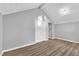 Bedroom with vaulted ceiling offering wood-look floors and a closet for storage at 924 Lynn Rd, Durham, NC 27703