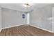Empty bedroom with hardwood flooring and natural light at 924 Lynn Rd, Durham, NC 27703
