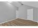 Spacious bedroom offering wood-look floors, light gray walls, and ample closet space at 924 Lynn Rd, Durham, NC 27703