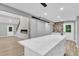 The open floor plan features a modern kitchen, fireplace and updated flooring at 924 Lynn Rd, Durham, NC 27703