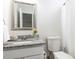 Well-lit bathroom features a granite countertop, a flower vase and a towel at 929 Mailwood Dr, Knightdale, NC 27545