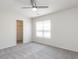Bedroom with a ceiling fan, window, and carpeted floors at 929 Mailwood Dr, Knightdale, NC 27545