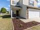 Charming home featuring a two-car garage and manicured front yard at 929 Mailwood Dr, Knightdale, NC 27545