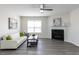Inviting living room with a fireplace, neutral colors, and ample natural light at 929 Mailwood Dr, Knightdale, NC 27545