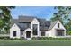 Stunning new construction featuring a white brick facade, gray accents, and professionally landscaped front yard at 97 Fox Oak Trl, Pittsboro, NC 27312